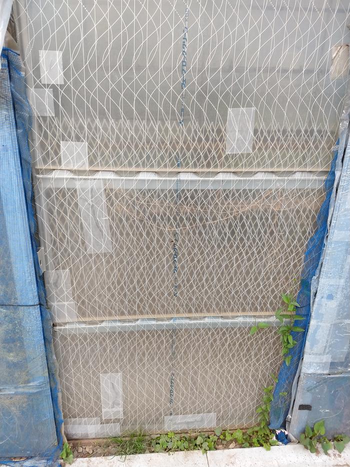 door with many holes patched