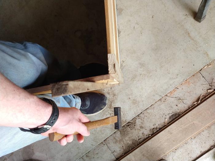 Putting together the side panels flat and horizontal first and then attaching the entire completed side makes this easier.
