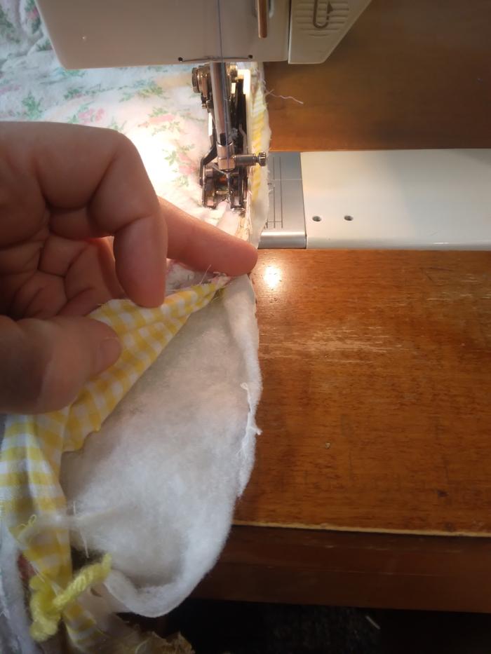 using a special quilting foot to go through all the layers here