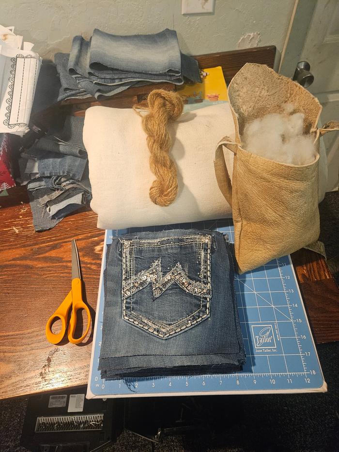 The squares all cut, along with the bamboo fleece and yarn. (This was the mohair)