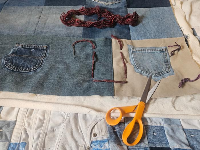 Tying the quilt with alpaca wool