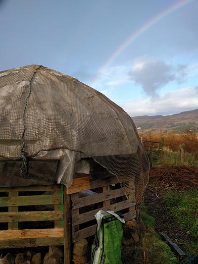 rainbow over scottish houses