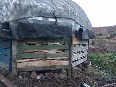 split hazel poles fill in pallet gaps