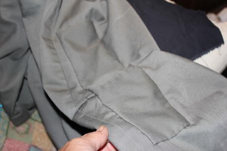 mending the seat on a pair of trousers