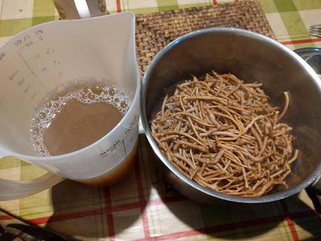 cooked silverweed roots in a saucepan