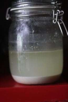 a glass jar with oat ferment