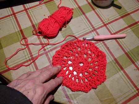 a red circle stitched in crochet