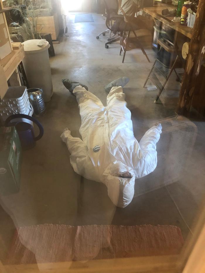 Erica cooling off on the concrete floor during insulation installation. We took rotating floor breaks