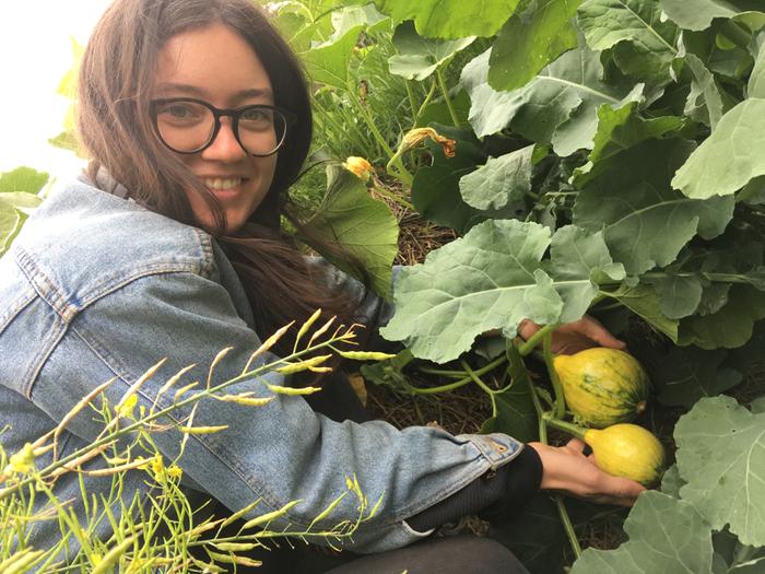 Me with some squash that are growing on my patch