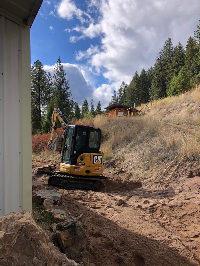 Grey in the excavator to put in a new hydrant on basecamp 