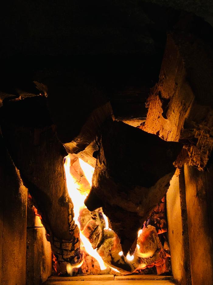 Tending the fire in the new rmh in the solarium 