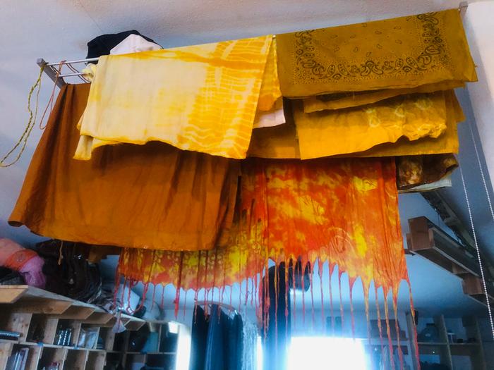 Our turmeric and yellow onion skin fabrics hanging to dry. The experiments with shibori techniques were a bit of a flop 
