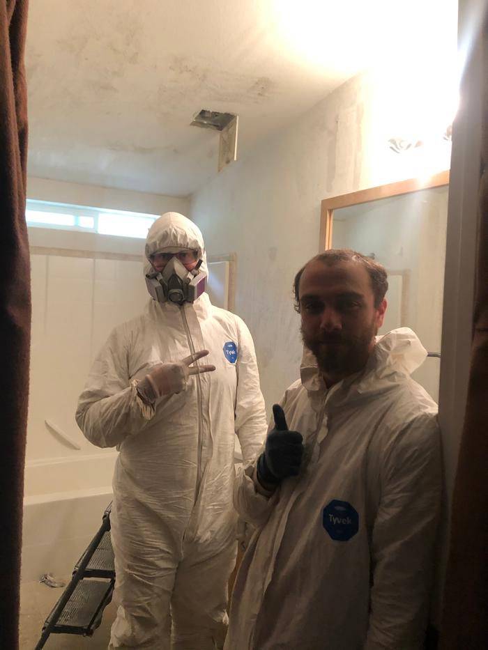 Grey and Kyle working on giving the bathroom a facelift 