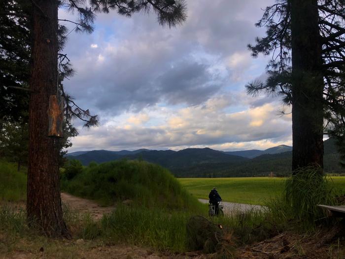 Nick rides off to cooper cabin on one of the electric bikes to tuck in for the night 