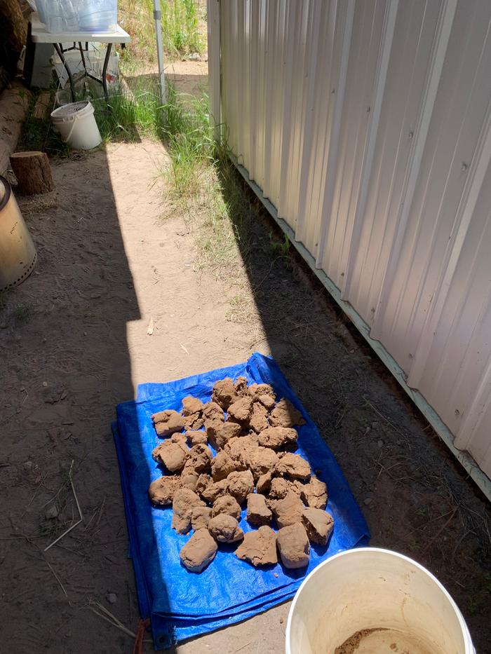 drying-clay-on-blue-tarp