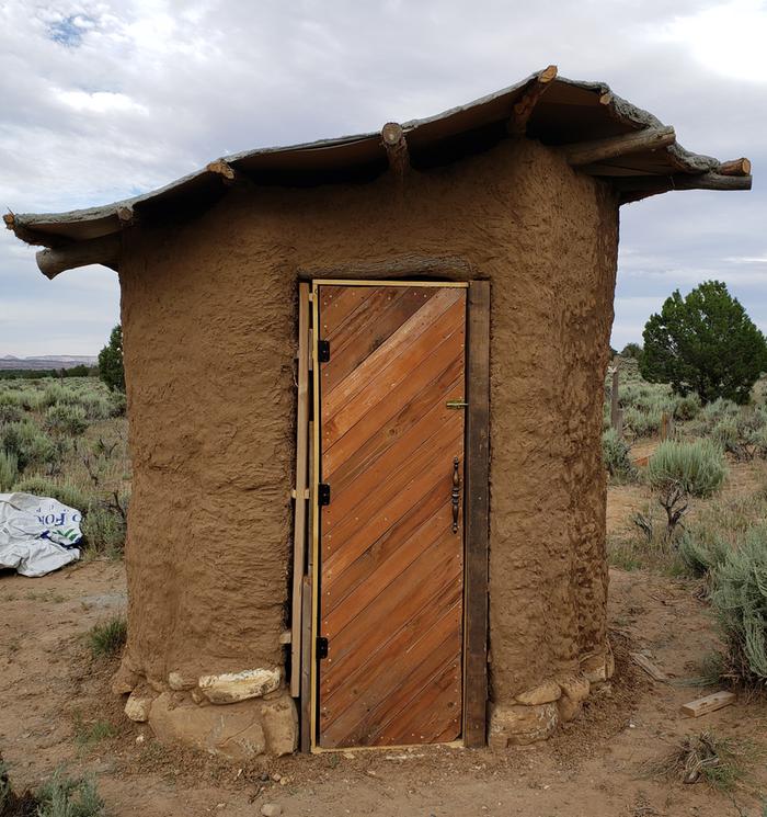 Cob privy handbuilt outhouse