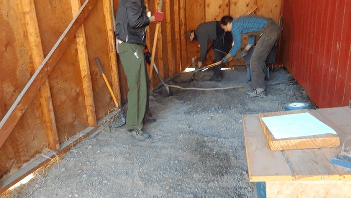 The base of the firebox is to be built so that the wood feed is at ground level and the cook top is at a sane height for normal human use. 