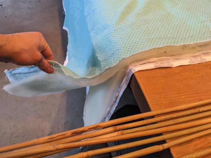 Starts with a double layer of wool fluff between to lengths of cotton fabric