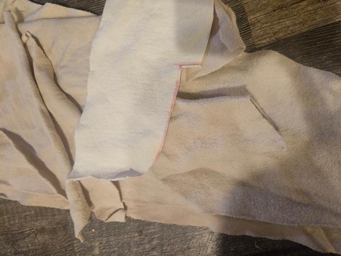 The cotton after washing with an undyed strip on top. Barely colored tan-ish