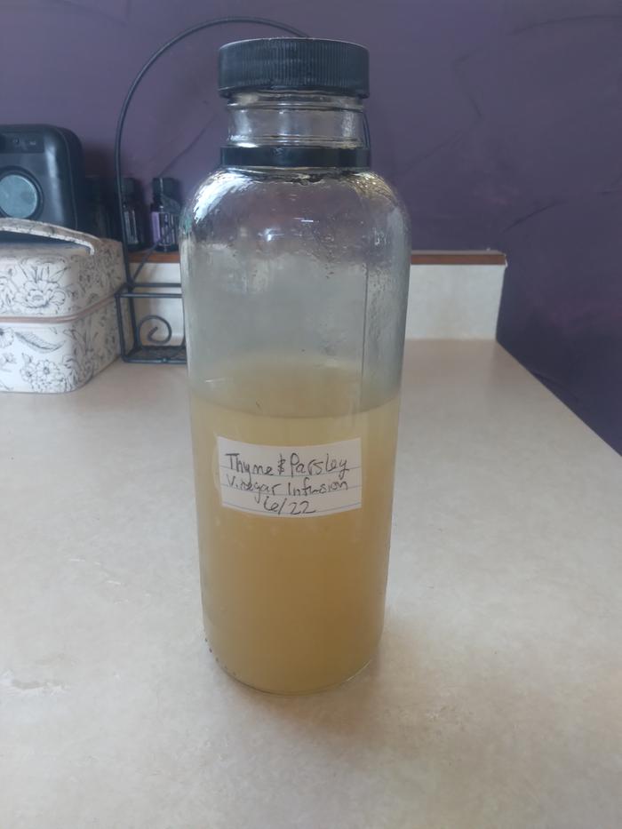 finished, labeled container of thyme infused vinegar