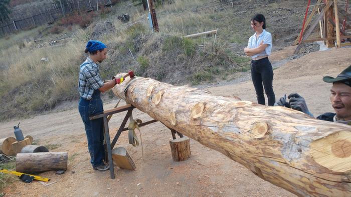 Grey, Megs, and Dez cutting notches for a support beam for the solarium