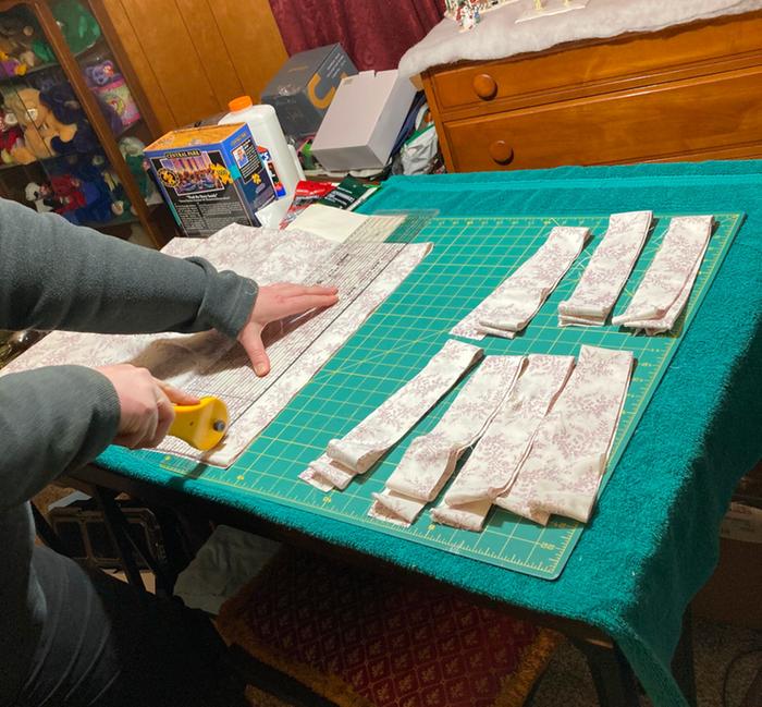 cutting strips from the cotton sheets