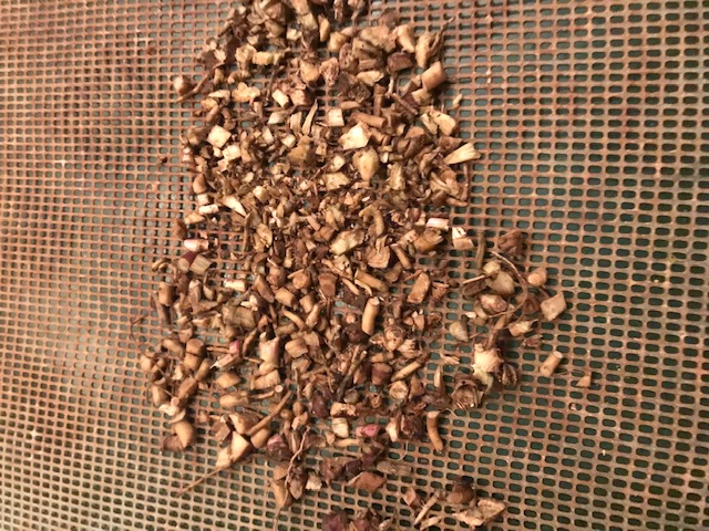 Tray of chopped roots that take longer to dry.