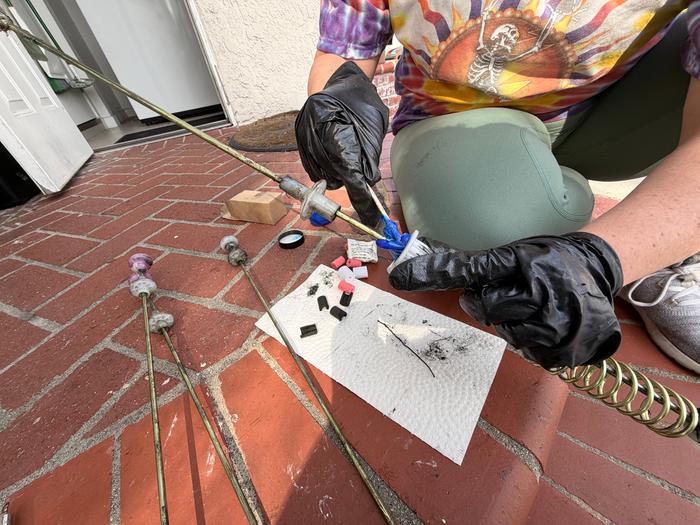 Me adding new goop to the rods