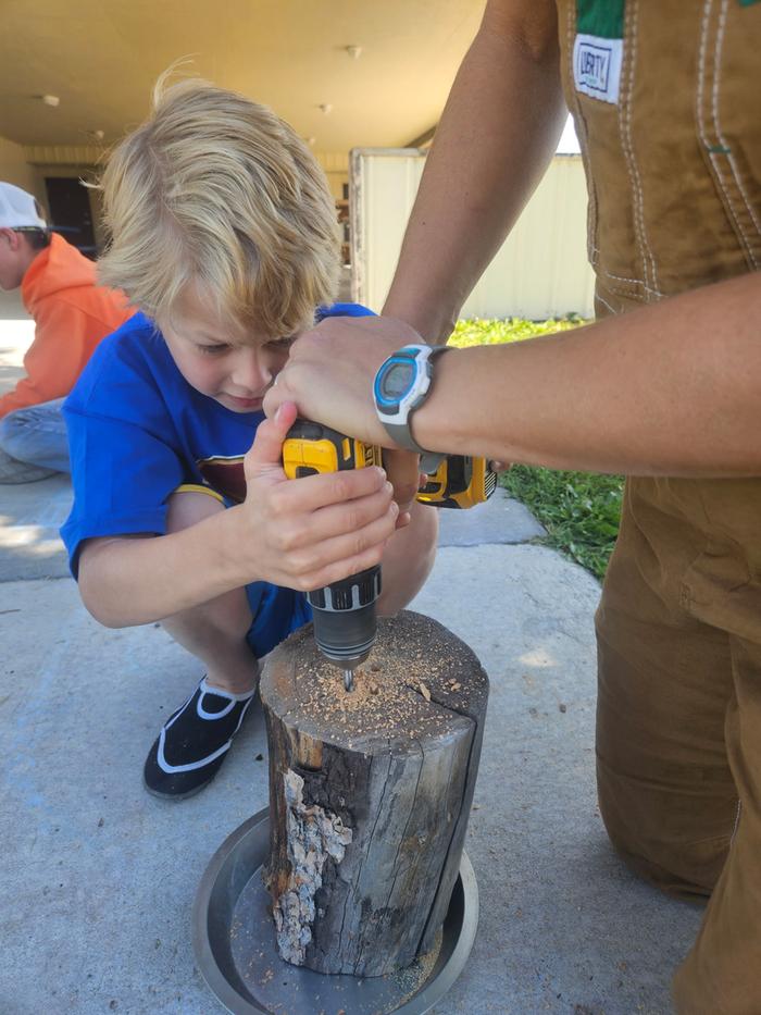 My kiddo wanted to help with the first couple holes. He likes power tools!