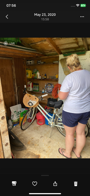 Storing her bike in our shed...