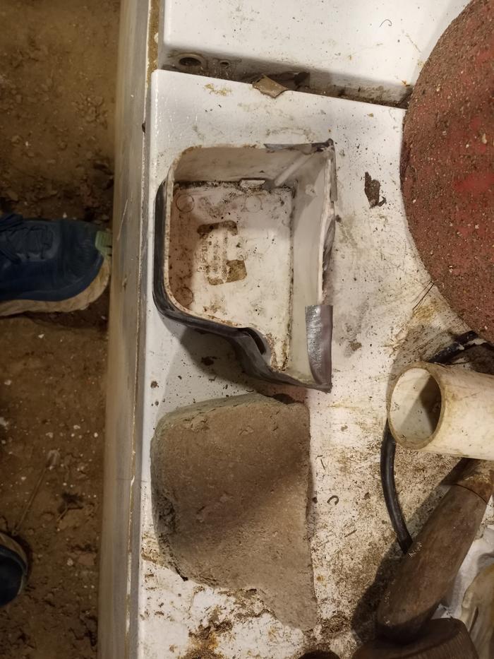 A cement end cap and the mold it came out of.