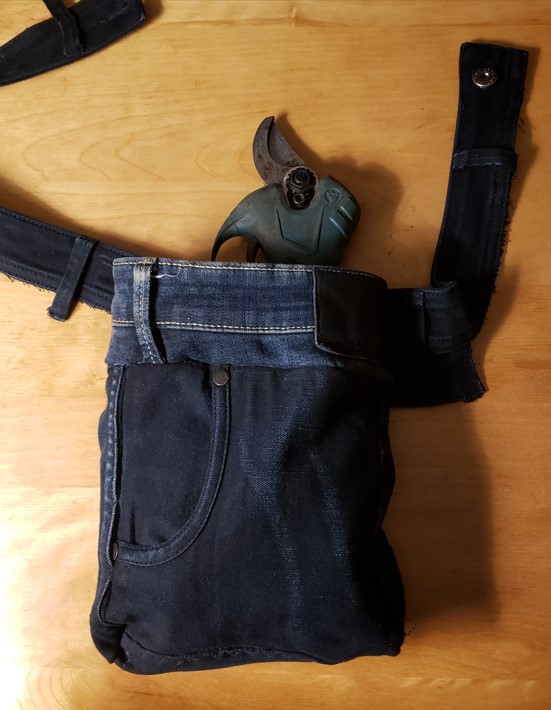 The waste band is long enough for over the shoulder, but with an extra button, I can wear it around my waist.