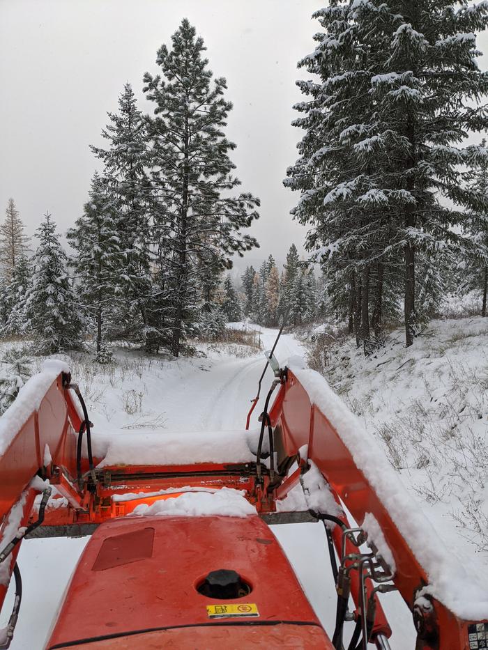 Heading down hill with the snow rolling like a wave off the rear blade. A much better start than I remember from last winter. 