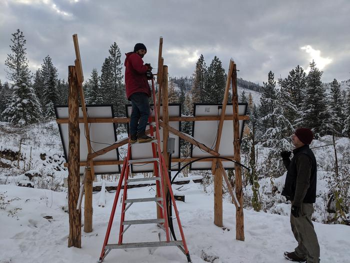 Grey taking the ladder as we build the solar rack up for the other two panels. 