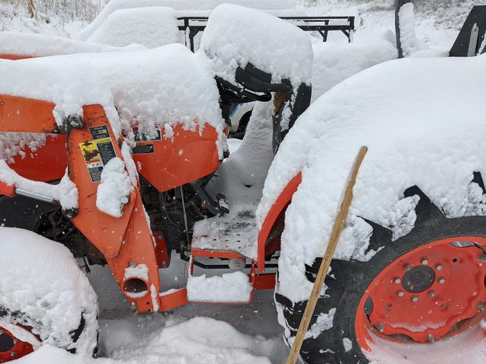 sometimes its hard to give a reference for the snow fall here. Getting ready to clear the tractor and then driveway. 