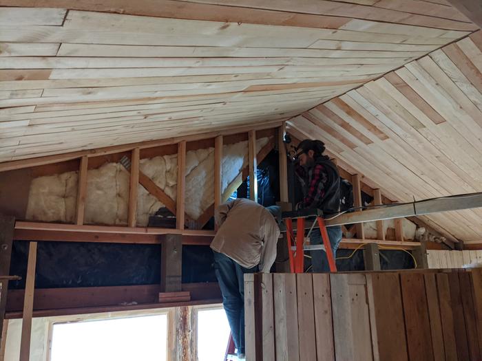 J n R installing studs for the last section of solarium to be insulated. 