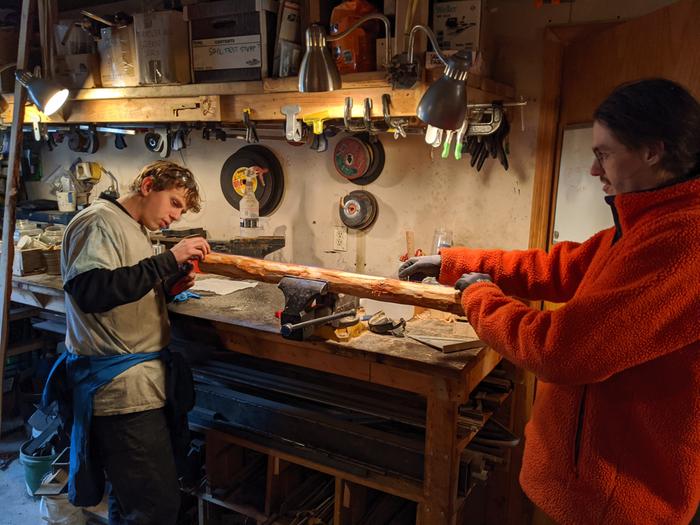 Reid and Wes working on the mortises for the backrest and legs of the chairs. 