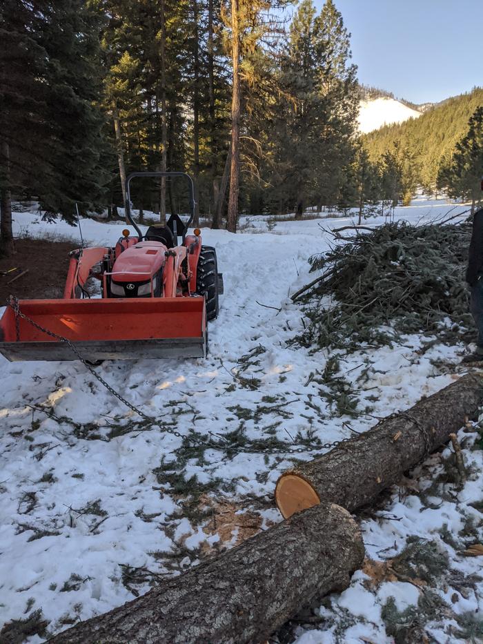 An attempt to grab some sawmill material out of a stronghold of snow. 