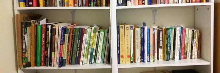 Two shelves of my favorite Permaculture and gardening books