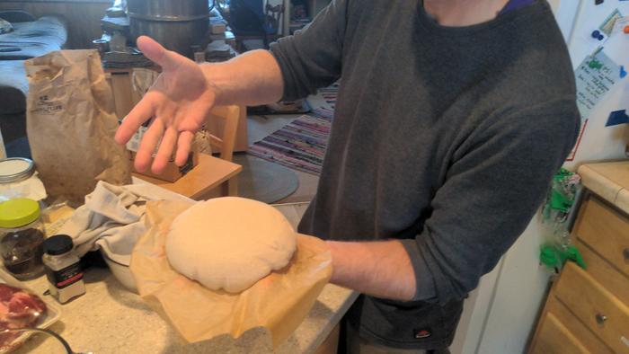 Stephen showing off his loaf, proofed and ready to bake