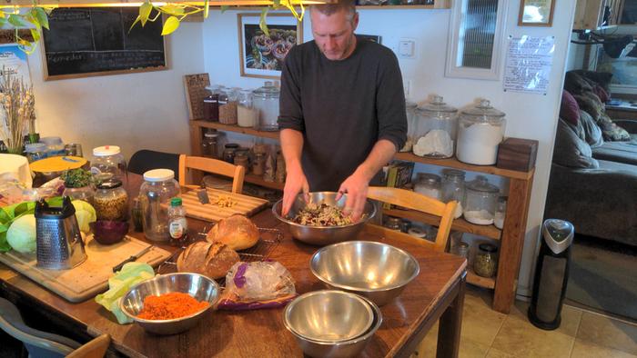 Stephen getting some "kraut therapy" by massaging cabbage