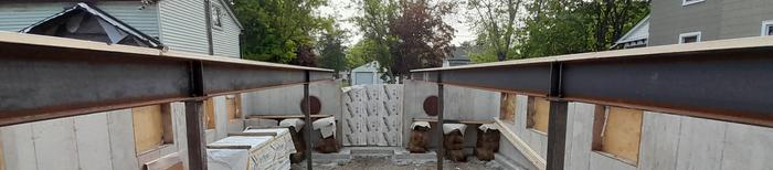 Sill plates are attached too the steel I beams