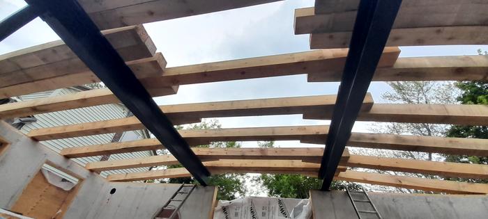 wooden beams on top of i-beam