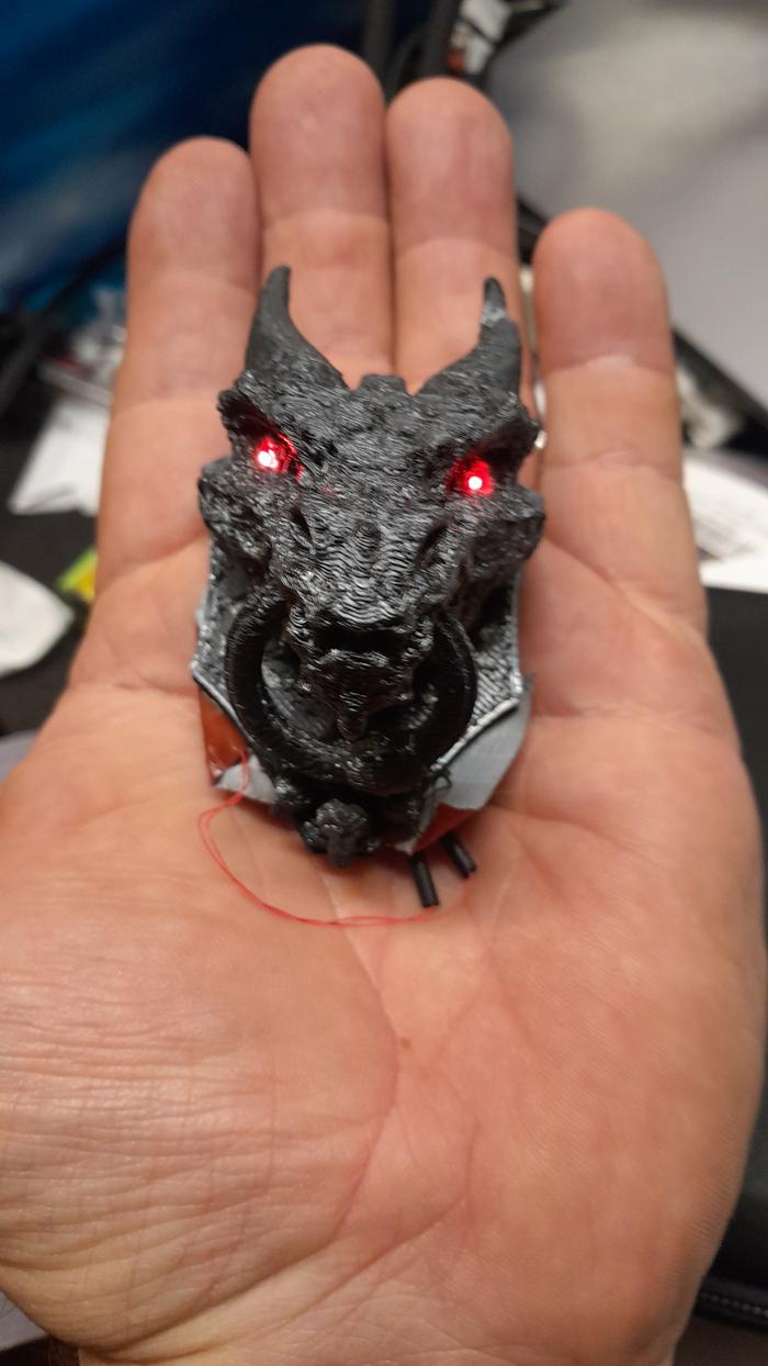 Dragon's head drawer pull in a hand