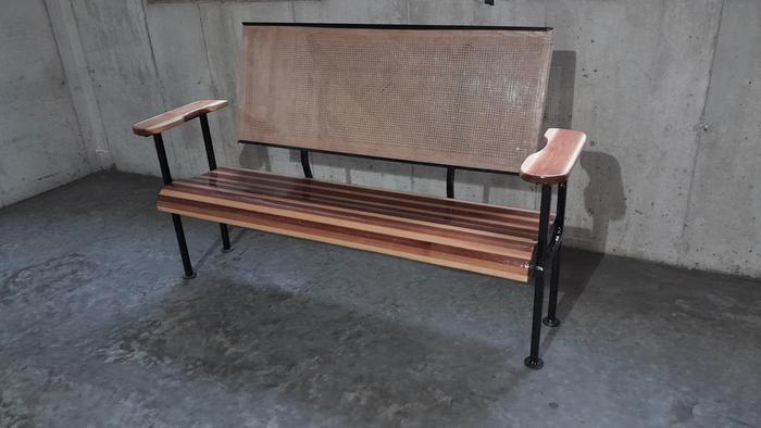 an outdoor bench inside the concrete of an underground house