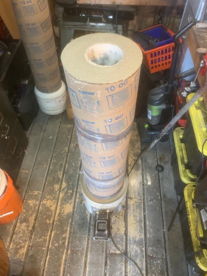 Refractory pour around tube
