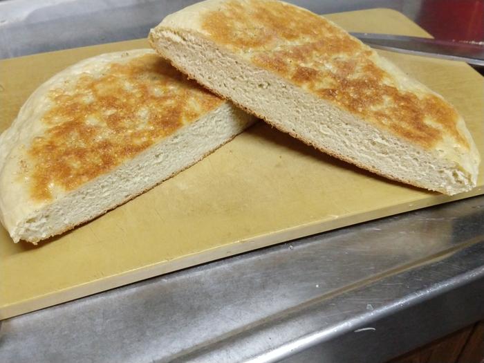 round loaf of bread baked in a frying pan