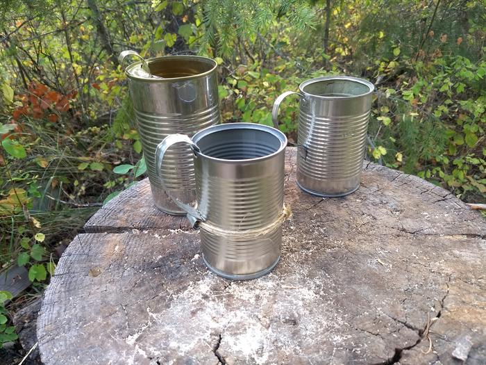 Three cans on a stump