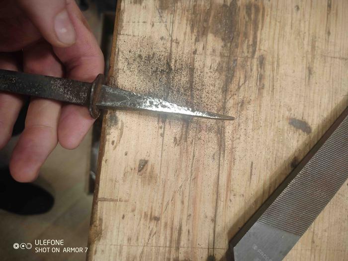 Filing the tang to create a bur