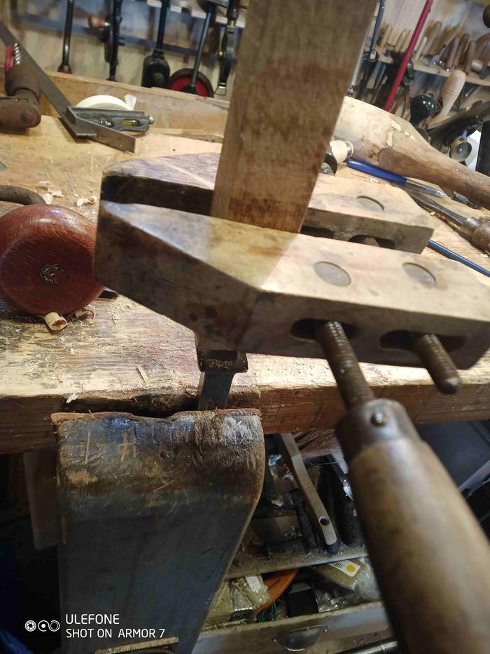 Using the tang as a reamer, my hand got tired turning the wood so put on a clamp for extra leverage/handle